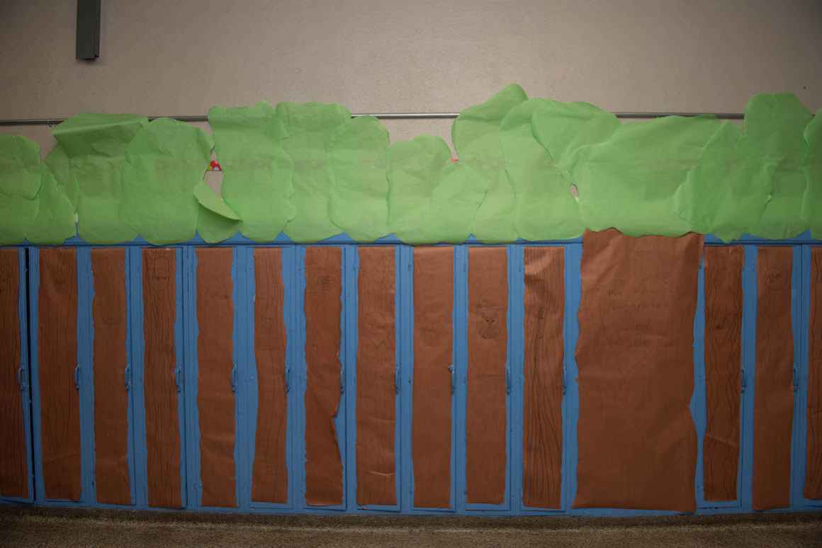 Old lockers are often covered with brightly colored crafts made by the children. Such is the case at Holbrock Elementary, where student-decorated trees form a forest amongst the lockers.